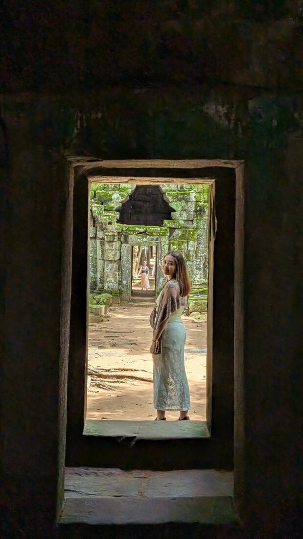Lyly in a temple doorway in Cambodia